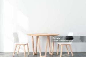 istockphoto-1143723849-1024x1024 Two wooden chairs with table in modern interior with white wall and concrete floor. 3d rendering